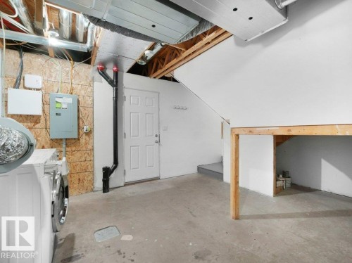 Unfinished basement featuring electric panel - 15 7385 Edgemont Way, Edmonton, AB - Indoor Photo Showing Basement