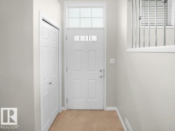 Doorway to outside featuring plenty of natural light - 