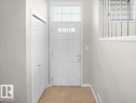 Doorway to outside featuring plenty of natural light - 15 7385 Edgemont Way, Edmonton, AB  - Indoor Photo Showing Other Room 