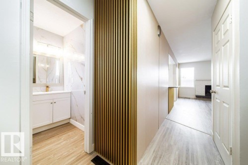 Hallway featuring light wood-style floors - 13833 24 Street, Edmonton, AB - Indoor Photo Showing Other Room