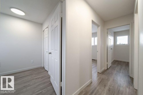 Hall featuring light wood-style flooring - 13833 24 Street, Edmonton, AB - Indoor Photo Showing Other Room