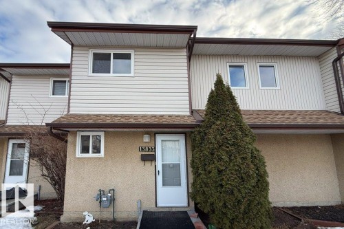 Traditional home featuring roof with shingles and stucco siding - 13833 24 Street, Edmonton, AB - Outdoor With Exterior
