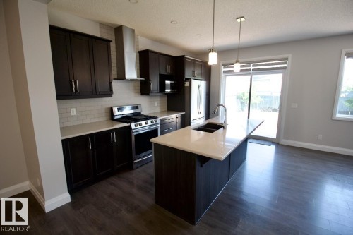 Upper 1929 Davidson Wynd, Edmonton, AB - Indoor Photo Showing Kitchen With Double Sink With Upgraded Kitchen