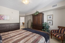 Carpeted bedroom with a textured ceiling - 