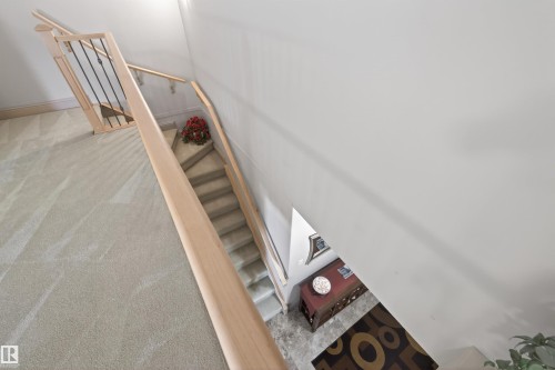 Staircase featuring carpet floors - 427 13005 140 Avenue, Edmonton, AB - Indoor Photo Showing Other Room
