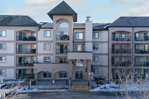 Snow covered property with a view of apartment building / complex - 427 13005 140 Avenue, Edmonton, AB - Outdoor With Facade