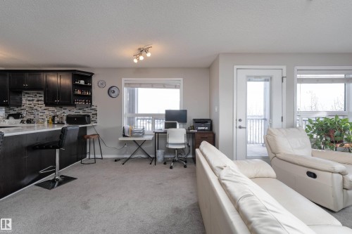 Office space with light colored carpet and a textured ceiling - 325 1520 Hammond Gate, Edmonton, AB - Indoor