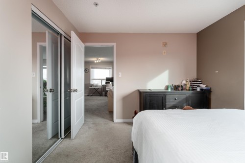 Bedroom featuring light colored carpet and a closet - 325 1520 Hammond Gate, Edmonton, AB - Indoor Photo Showing Bedroom