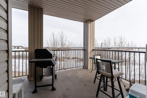 Snow covered back of property featuring grilling area - 325 1520 Hammond Gate, Edmonton, AB - Outdoor With Balcony With Exterior