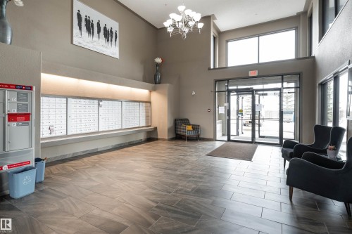 Common area with a high ceiling - 325 1520 Hammond Gate, Edmonton, AB - Indoor Photo Showing Other Room