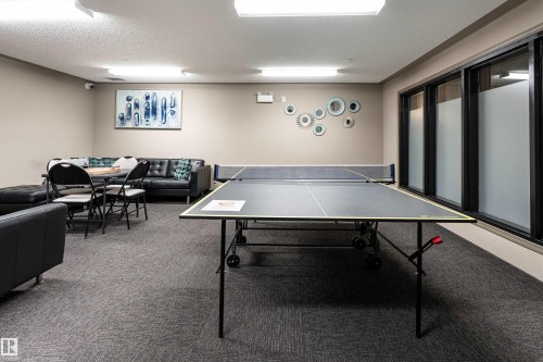 Game room with a textured ceiling - 325 1520 Hammond Gate, Edmonton, AB - Indoor Photo Showing Other Room