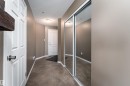 Corridor with a textured ceiling and carpet - 325 1520 Hammond Gate, Edmonton, AB  - Indoor Photo Showing Other Room 