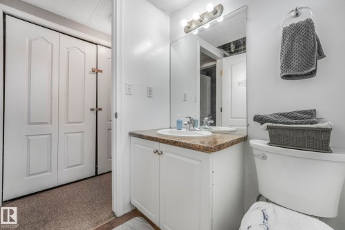 Half bathroom with vanity and toilet - 14924 81 Street, Edmonton, AB 