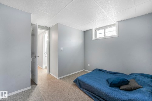 Bedroom featuring a paneled ceiling and carpet floors - 14924 81 Street, Edmonton, AB 