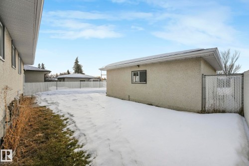 Snow covered property with stucco siding - 14924 81 Street, Edmonton, AB 