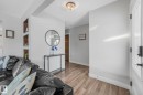 Living room featuring baseboards and light wood-type flooring - 14924 81 Street, Edmonton, AB 