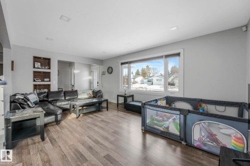 Living area with wood finished floors and built in features - 14924 81 Street, Edmonton, AB 