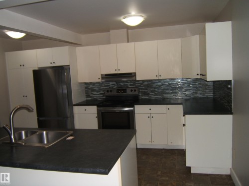 4901 47 Avenue, Myrnam, AB - Indoor Photo Showing Kitchen With Double Sink
