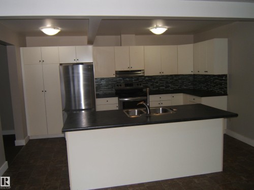 4901 47 Avenue, Myrnam, AB - Indoor Photo Showing Kitchen With Double Sink