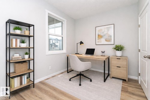Office space featuring light wood-style flooring - 3949 Wren Loop, Edmonton, AB - Indoor Photo Showing Office