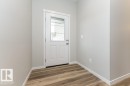 Doorway featuring wood finished floors - 3949 Wren Loop, Edmonton, AB  - Indoor Photo Showing Other Room 