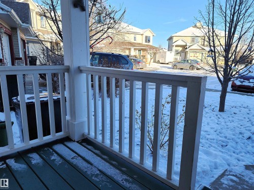 Snow covered deck with a residential view - 5424 204 Street, Edmonton, AB - Outdoor