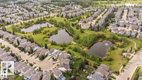 Aerial overview of property's location with nearby suburban area and a nearby body of water - 5424 204 Street, Edmonton, AB - Outdoor With View