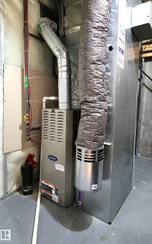 Utilities featuring heating unit - 5424 204 Street, Edmonton, AB - Indoor Photo Showing Basement