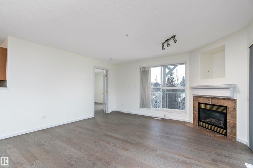 409 10221 111 Street, Edmonton, AB - Indoor Photo Showing Living Room With Fireplace