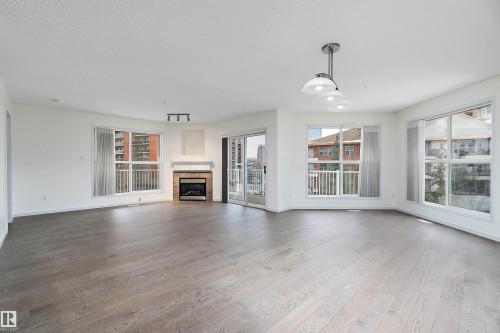 409 10221 111 Street, Edmonton, AB - Indoor Photo Showing Living Room With Fireplace