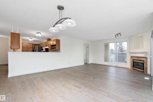 409 10221 111 Street, Edmonton, AB - Indoor Photo Showing Living Room With Fireplace