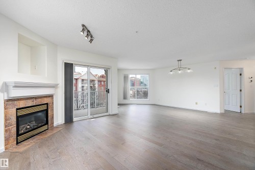 409 10221 111 Street, Edmonton, AB - Indoor Photo Showing Living Room With Fireplace