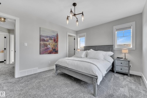 Bedroom featuring carpet flooring and baseboards - 7613 16 Av Sw, Edmonton, AB - Indoor Photo Showing Bedroom