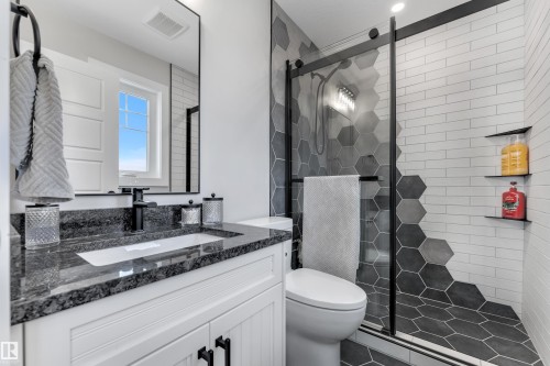 Full bath featuring vanity and a stall shower - 7613 16 Av Sw, Edmonton, AB - Indoor Photo Showing Bathroom