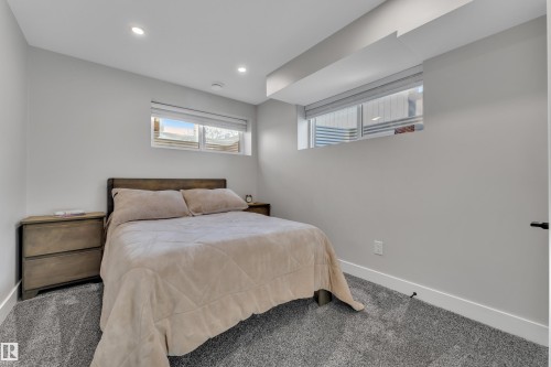 Bedroom with carpet floors and recessed lighting - 7613 16 Av Sw, Edmonton, AB - Indoor Photo Showing Bedroom