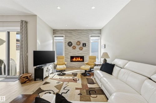 4605 Knight Point(E), Edmonton, AB - Indoor Photo Showing Living Room With Fireplace