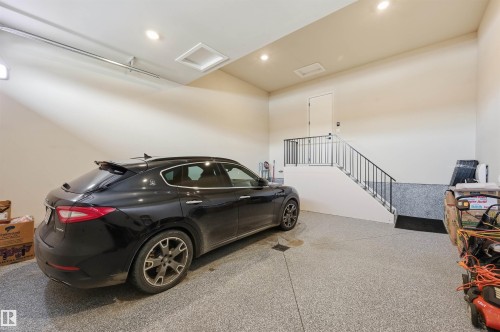 Oversized double garage w/just under 12 ft ceilings to accomodate a car lift. - 4605 Knight Point(E), Edmonton, AB - Indoor Photo Showing Garage
