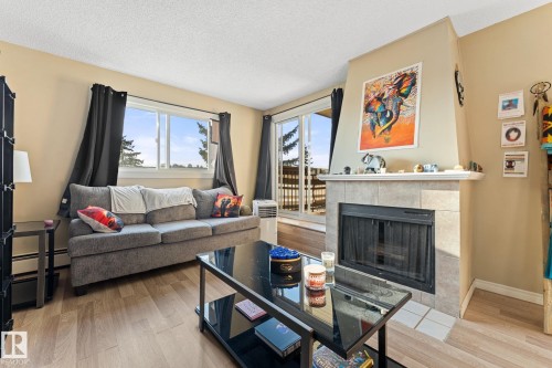 202 2904 139 Avenue, Edmonton, AB - Indoor Photo Showing Living Room With Fireplace
