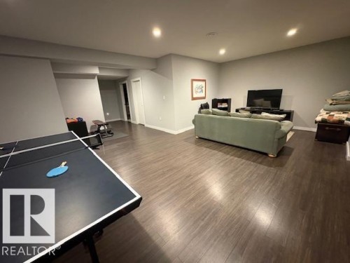 Rec room featuring recessed lighting and dark laminate floors - 867 Armitage Wynd Sw, Edmonton, AB - Indoor