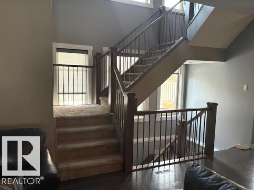 Carpeted floating stairs - 867 Armitage Wynd Sw, Edmonton, AB - Indoor Photo Showing Other Room