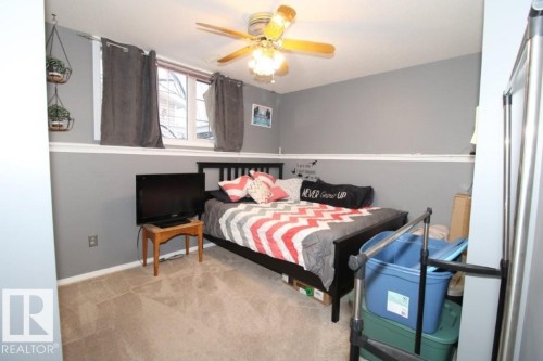 Bedroom with carpet floors and ceiling fan - 2812 35 Street Nw, Edmonton, AB - Indoor Photo Showing Bedroom