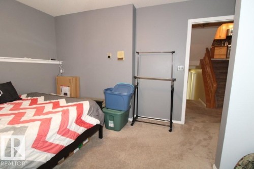 Bedroom with light carpet - 2812 35 Street Nw, Edmonton, AB - Indoor Photo Showing Bedroom