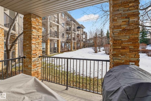 View of snow covered back of property - 131 1520 Hammong Gate, Edmonton, AB - Outdoor