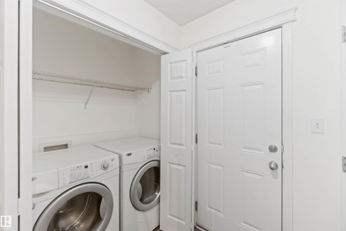 Laundry area featuring separate washer and dryer - 4507 164A Avenue, Edmonton, AB - Indoor Photo Showing Laundry Room