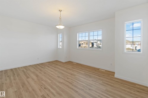 Spare room with light wood-type flooring and baseboards - 4507 164A Avenue, Edmonton, AB - Indoor Photo Showing Other Room