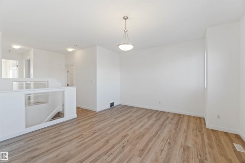 Unfurnished room with light wood-style flooring and baseboards - 4507 164A Avenue, Edmonton, AB - Indoor Photo Showing Other Room