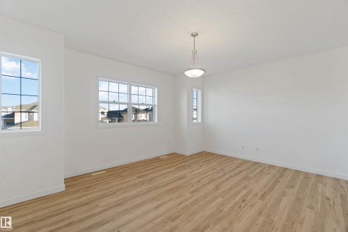 Unfurnished room with light wood-style floors and baseboards - 4507 164A Avenue, Edmonton, AB - Indoor Photo Showing Other Room