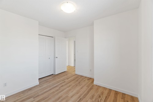 Unfurnished bedroom featuring light wood-type flooring and a closet - 4507 164A Avenue, Edmonton, AB - Indoor Photo Showing Other Room