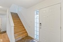 Foyer with stairway and dark wood-style flooring - 4507 164A Avenue, Edmonton, AB  - Indoor Photo Showing Other Room 