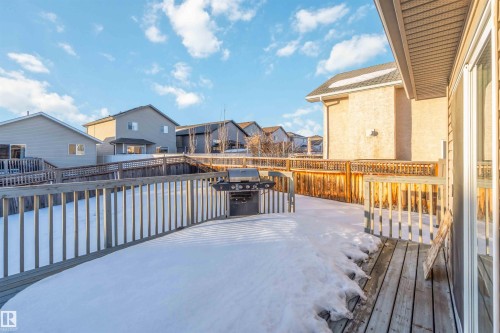 Snow covered deck featuring a residential view, area for grilling, and a fenced backyard - 4507 164A Avenue, Edmonton, AB - Outdoor With Deck Patio Veranda With Exterior